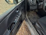 the interior of a car with the door open showing the dashboard