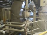 a large machine that is sitting inside of a building