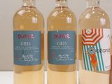 three bottles of wine sitting next to each other on a table