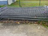 a pile of wire mesh in front of a building