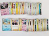 a lot of pokemon cards on the table together