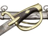 a close up of a sword with a gold handle