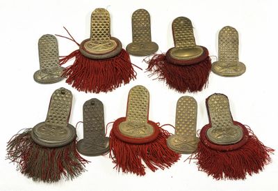 several different types of brushes are lined up on a white surface