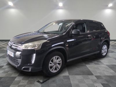a picture of a black suv parked in a garage