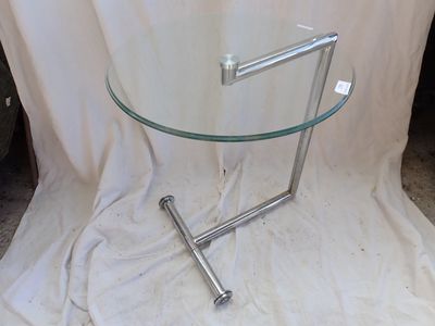 a glass table with a metal frame and a glass top