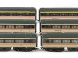 several model trains are stacked on top of each other on a white surface