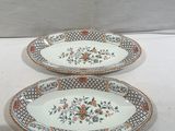 two plates that are sitting on a table