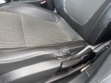 a black seat in the back of a car with a black arm rest