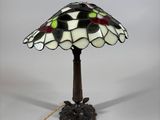 a close up of a lamp on a table with a white background
