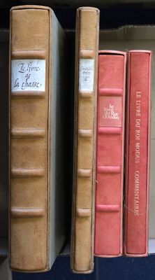 many books that are on a shelf in a library