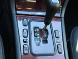 a close up of a car ' s gear lever in the center console