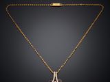 a gold necklace with a purple and white diamond pendant on a gold chain