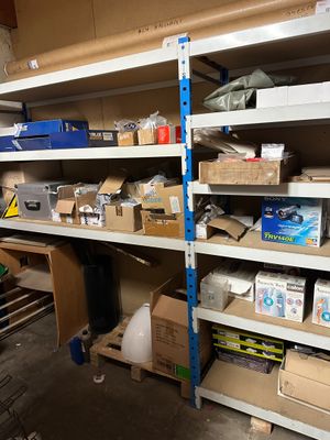 many boxes and boxes on the shelves in the garage