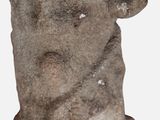 a stone object that is sitting on a white surface