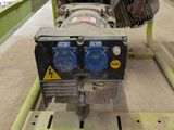 a machine that is sitting on a stand in a garage