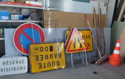 a lot of signs that are sitting on the floor