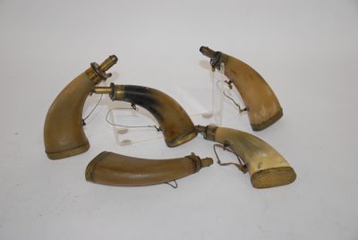 three pieces of horn horn are sitting on a white surface
