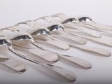 a lot of spoons that are sitting on a table