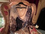 a dress on a hanger on a chair in a room