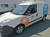 a van that is parked in front of a building