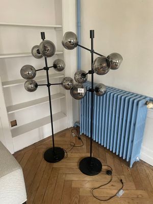 an image of a living room with a radiator and a lamp