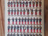 an old book with a bunch of military uniforms on it