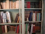 many books on the shelves in the room