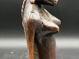 an image of a statue of a woman holding a basket on her head