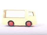a yellow toy bus with red wheels on a white surface