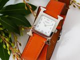 a watch that is sitting on top of a leather strap