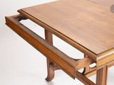 a wooden table with a drawer on top of it