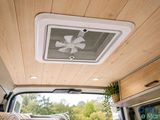 an image of a camper van with a ceiling fan in the back