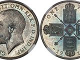 a close up of a coin with a cross on it
