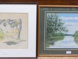 two framed pictures of a river and trees on the wall