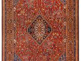 a red and blue rug with a medallion design on it
