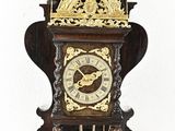 a clock that is hanging on the wall in the room
