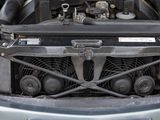 a close up of a car ' s engine with the hood open