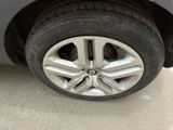 a close up of a tire on a car ' s rim