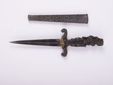 pair of old and rusty knifes on a white surface