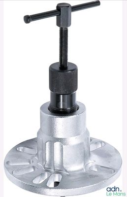 a close up of a metal ball valve with a black handle