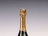 a close up of a bottle of champagne on a table