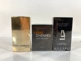 three different types of perfumes sitting on a table