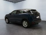 an image of a blue car in a garage
