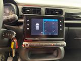 a picture of a car dashboard with a car key attached to it