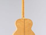 an acoustic guitar hanging from the ceiling