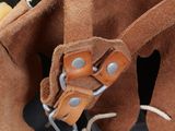 a brown leather bag with a handle and two straps