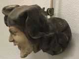 a statue of a man with a hat on it ' s head