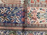 a close up of a rug with many different designs on it