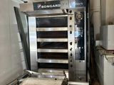 a large oven that is sitting inside of a kitchen