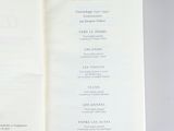 someone is holding a book open to a page with a list on it